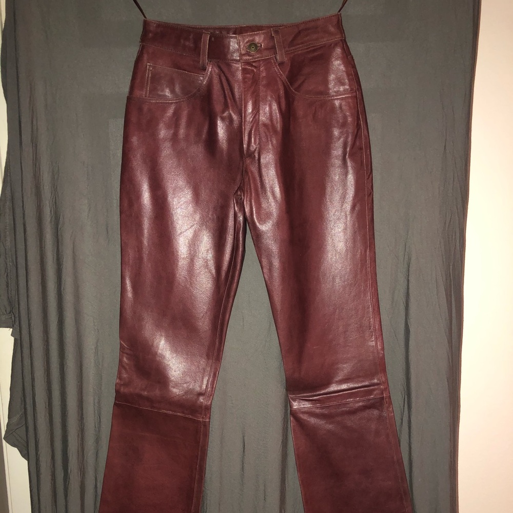 Maroon/burgundy colored leather pants. Wilson’s